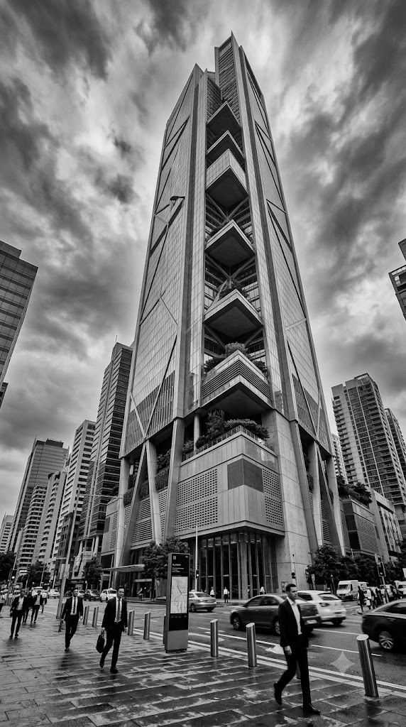 Modern skyscraper rising above a city street
